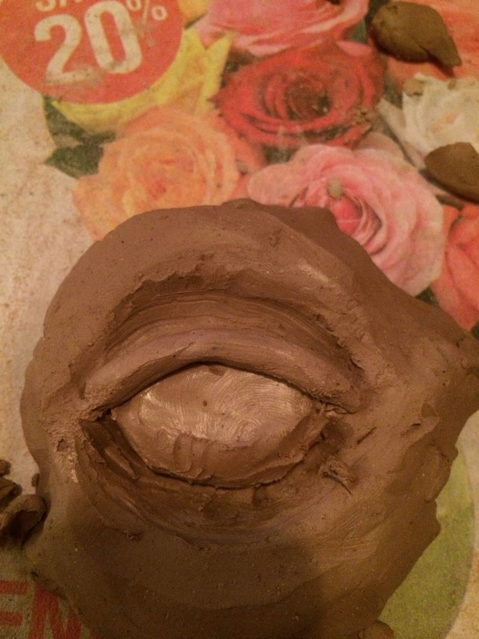 Add the second coil on the eye ball next to the coil that was just smoothed out.