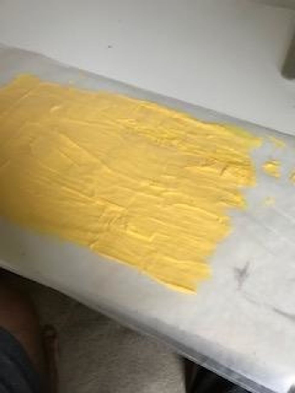 add the second piece of wax paper and smooth it out with hands