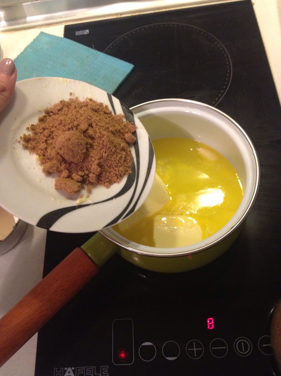 Add the second portion of water (2/3cup in us term) butter brown sugar and sugar to a sauce pan. Bring the ingredients to boil, make sure everything's dissolved.