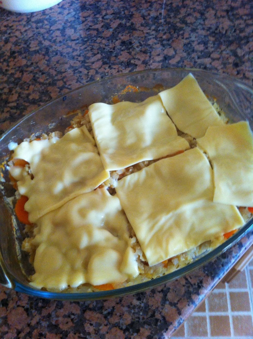 Add the selected cheese "slices is the only ones I had at that time :-(" And put it in the oven again for few more minutes until its melted or lightly darkened