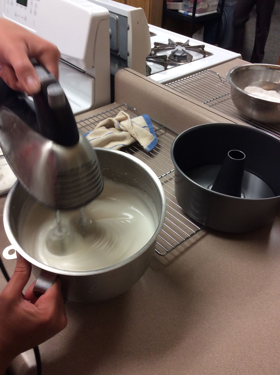 Add the separated sugar to the egg white mix