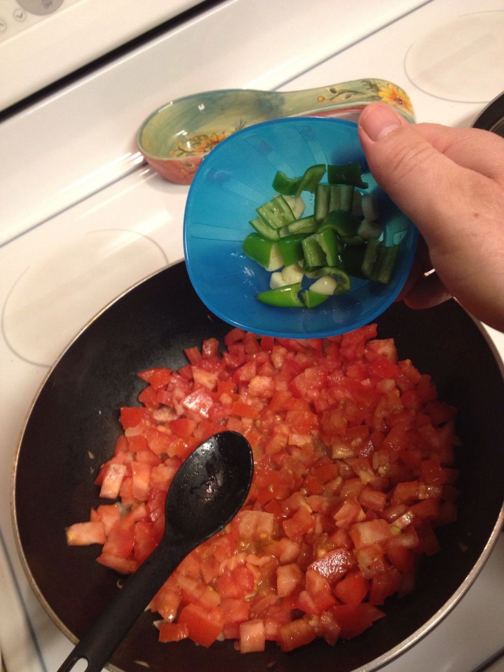 Add the serrano pepper & the clove of garlic chop.