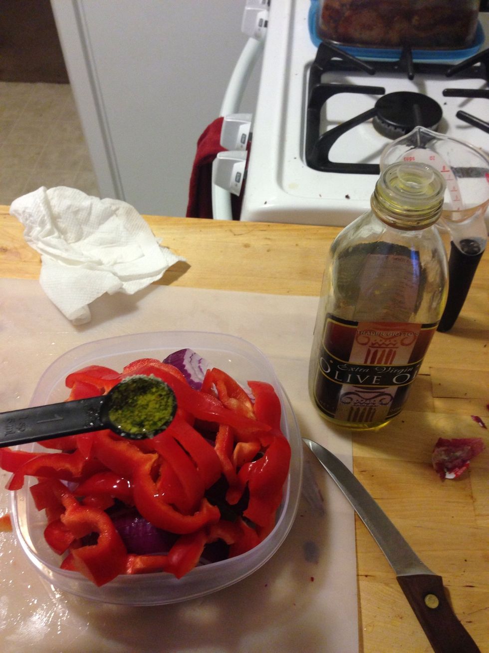 Add the set aside mixture to the onions and bell peppers. You can add an optional 1 tsp of olive oil.