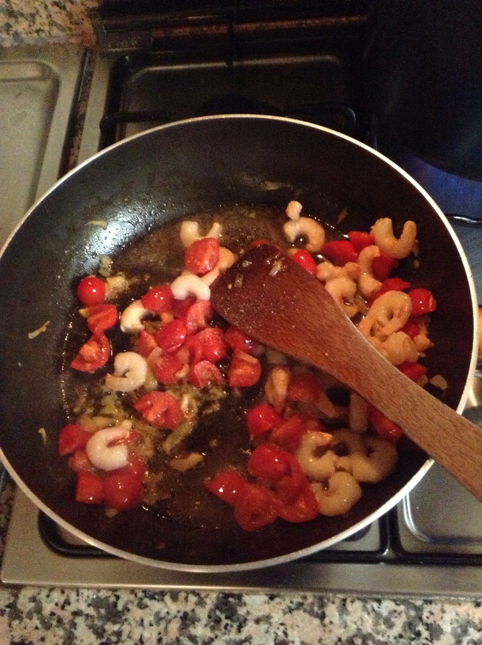 Add the shrimps and a splash of wine. Cook over high heat until wine evaporates.