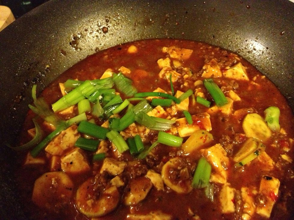 Add the Sichuan peppercorn/powder and chopped green onion. Gently stir and blend well.