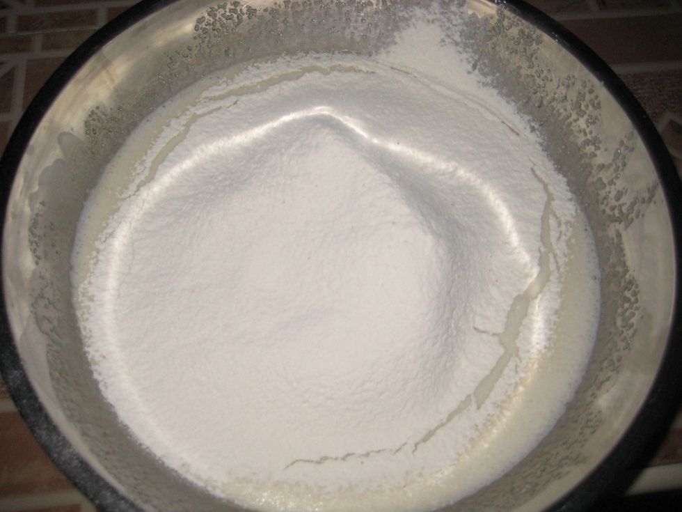 Add the sifted flour and vanilla extract.