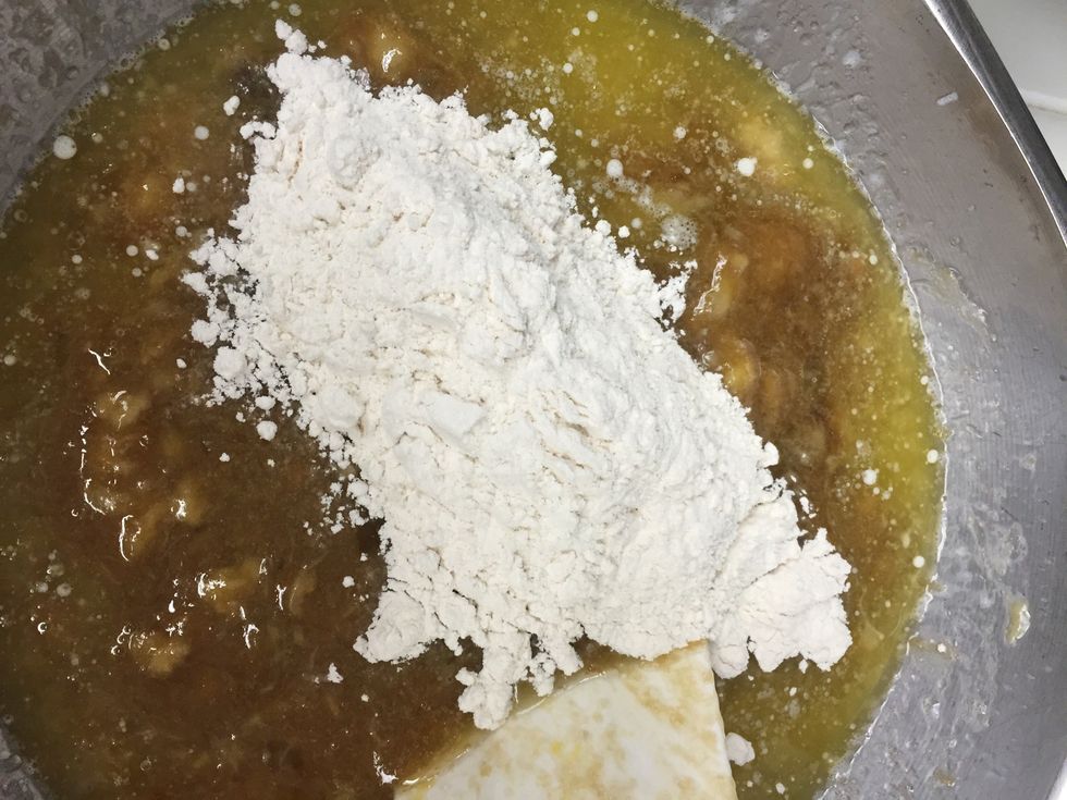 Add the sifted flour.