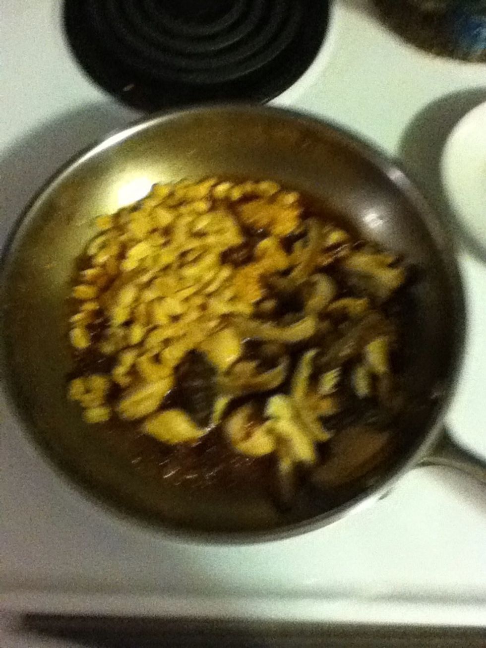 Add the sliced mushrooms (remember those?) and some dry roasted peanuts and stir fry for a bit.