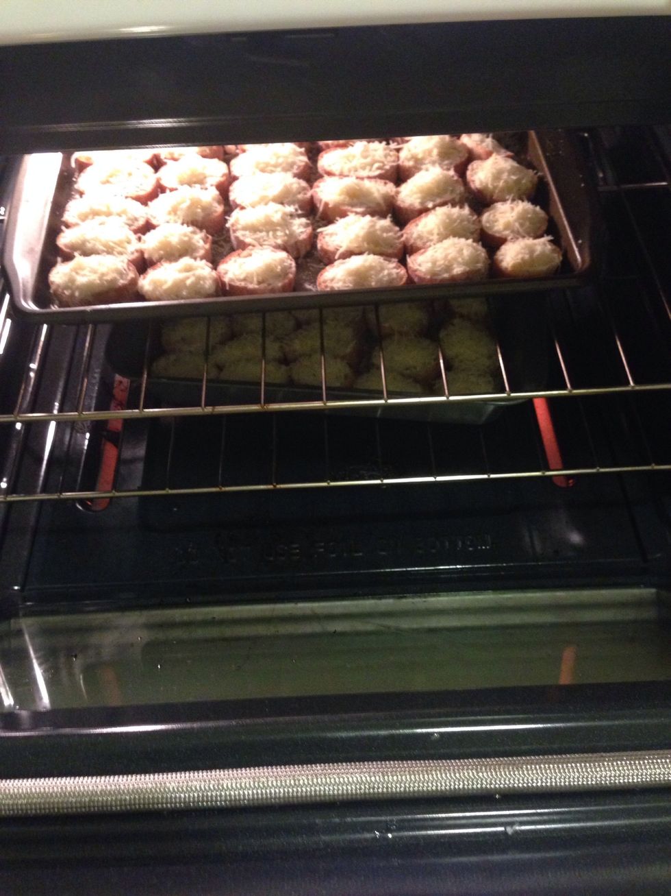 Add the slices to the oven and cook for about 10-12mins or until the cheese melts. Serve at your party and enjoy the delicious cheesy garlic bread slices.