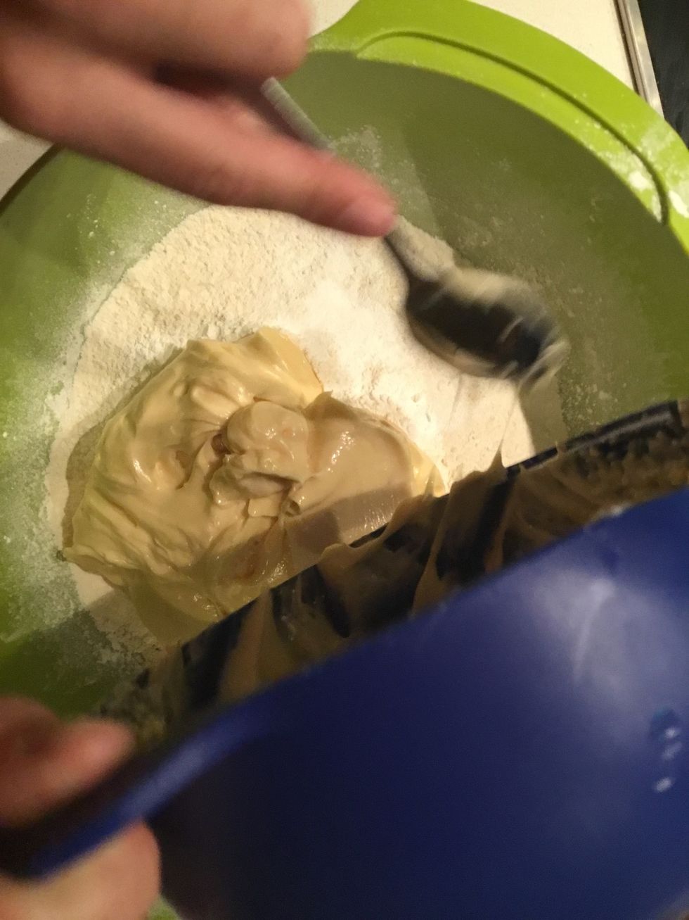 Add the smooth mixture you just made to the flour and add a small bit of vanilla Essence