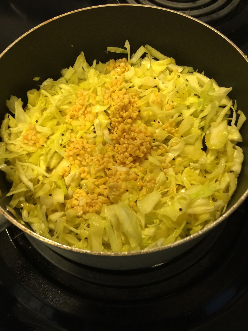 Add the soaked dal to the cabbage. Mix well.