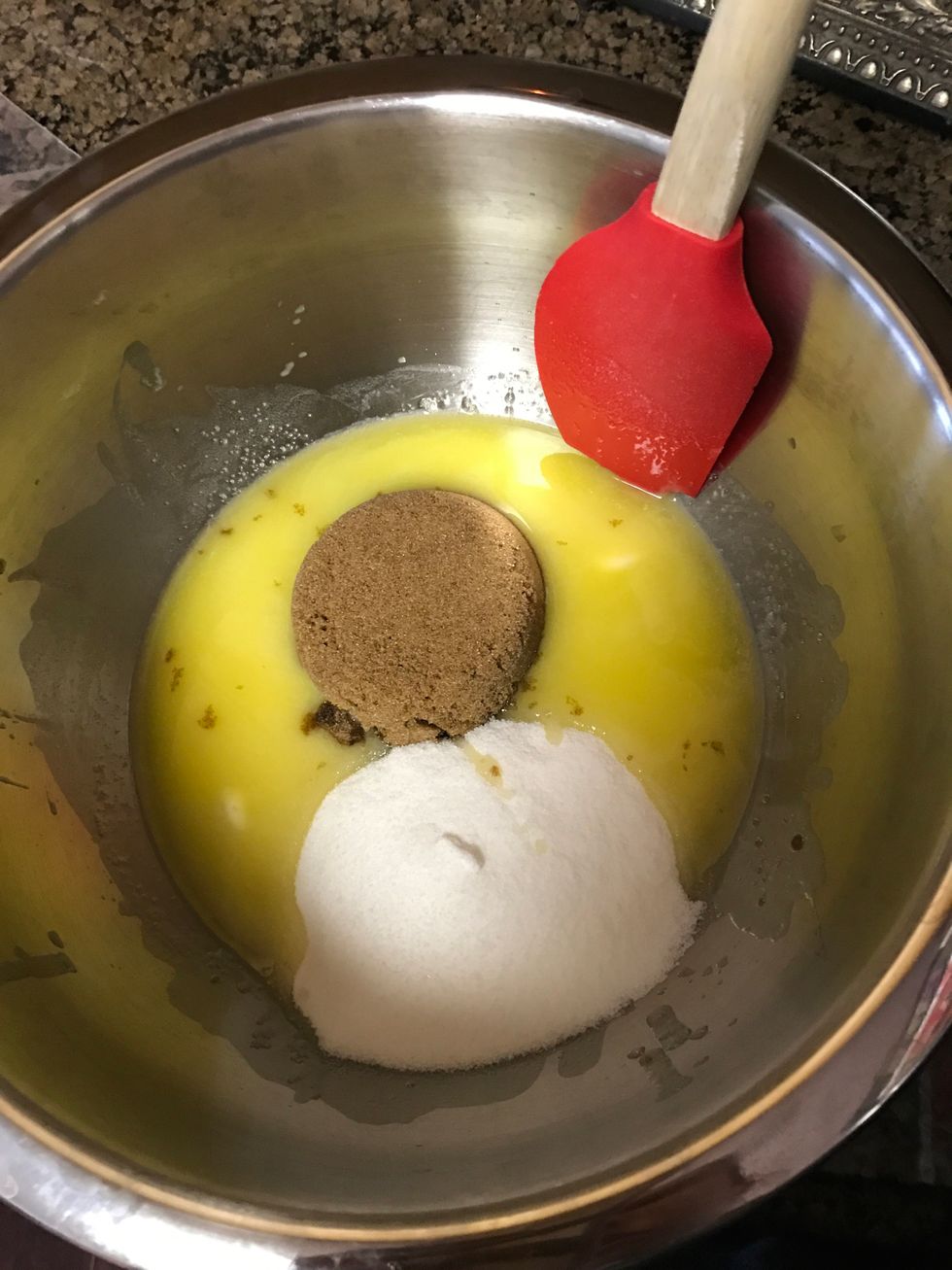 Add the softened butter, brown sugar, and white sugar into a bowl