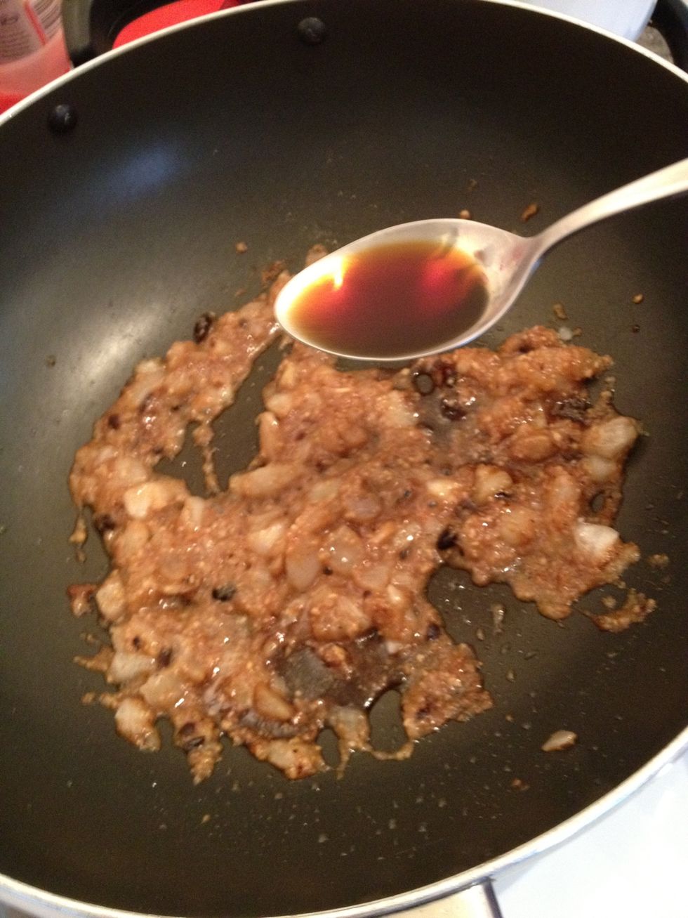 Add the soy sauce and stir evenly. Add in the white pepper powder as well.