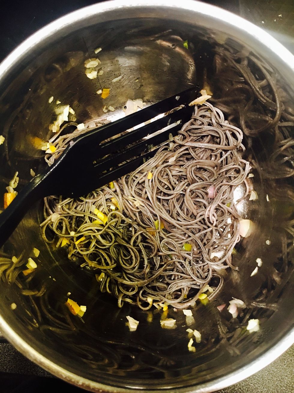 Add the spaghetti and turn down the heat to low/medium. Stir.