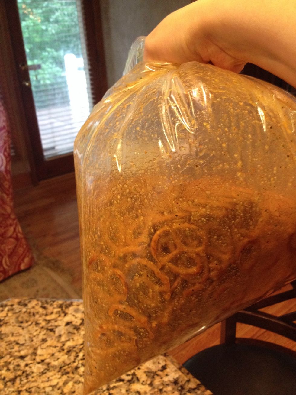 Add the spicy mixture and toss well. I close top and allow air in bag so as you shake, it doesn't break up the pretzels
