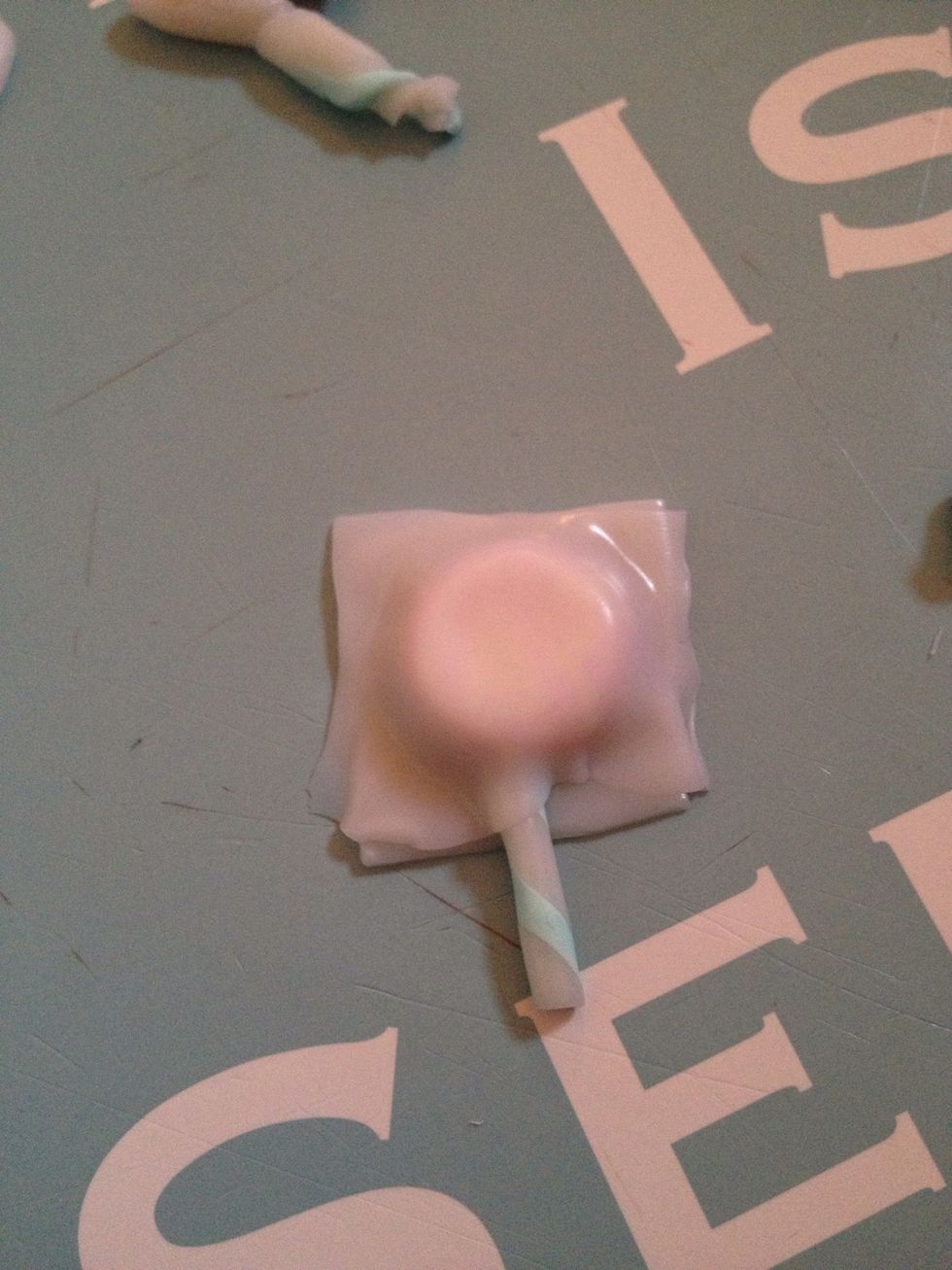 Add the stick then add the other translucent clay on top.