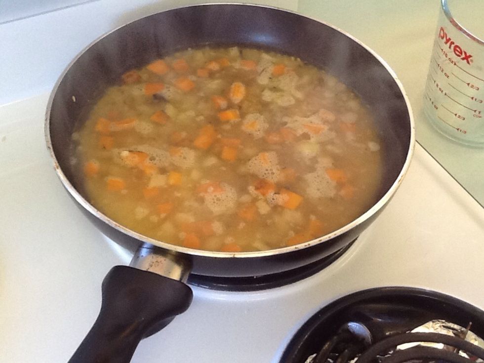 Add the stock in ( 2 cups of water and 1 teaspoon of vegetable stock powder)