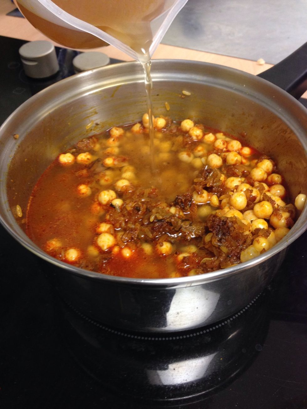 Add the stock into the mixture.