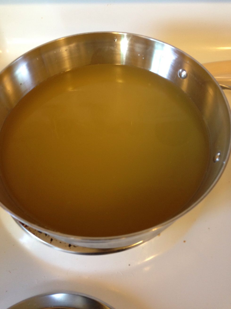 Add the stock to a pan, and heat to a summer, then reduce heat to low/med to keep warm