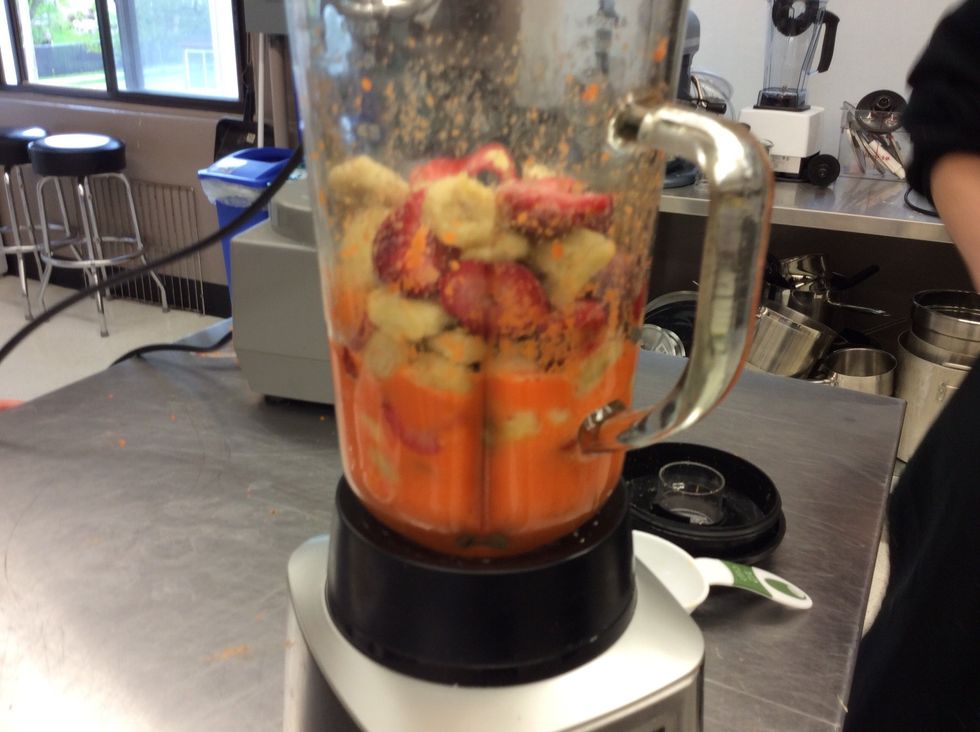 Add the strawberries and bananas into the blender