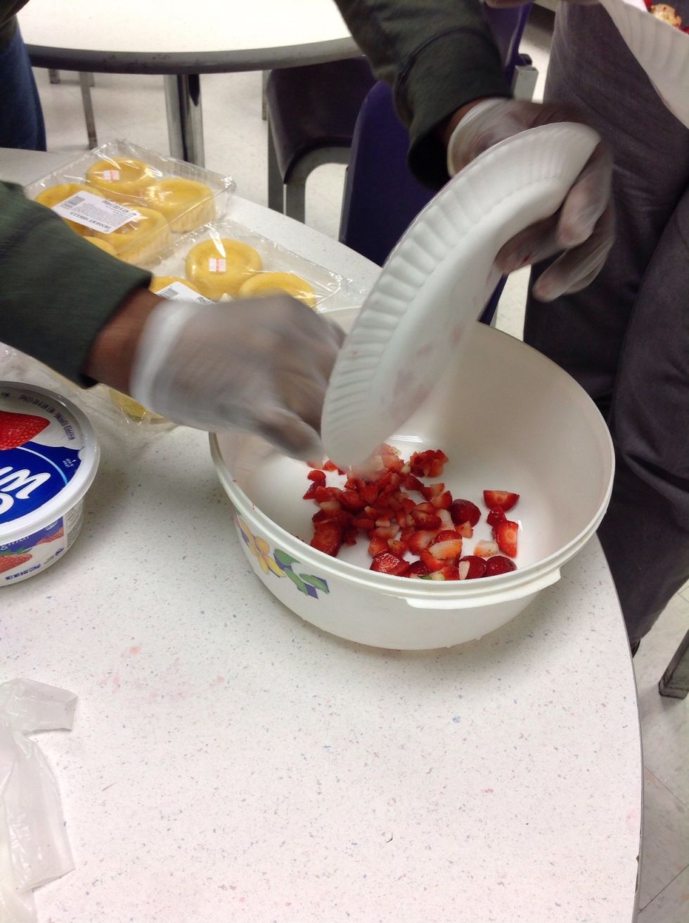 Add the strawberries to a bowl