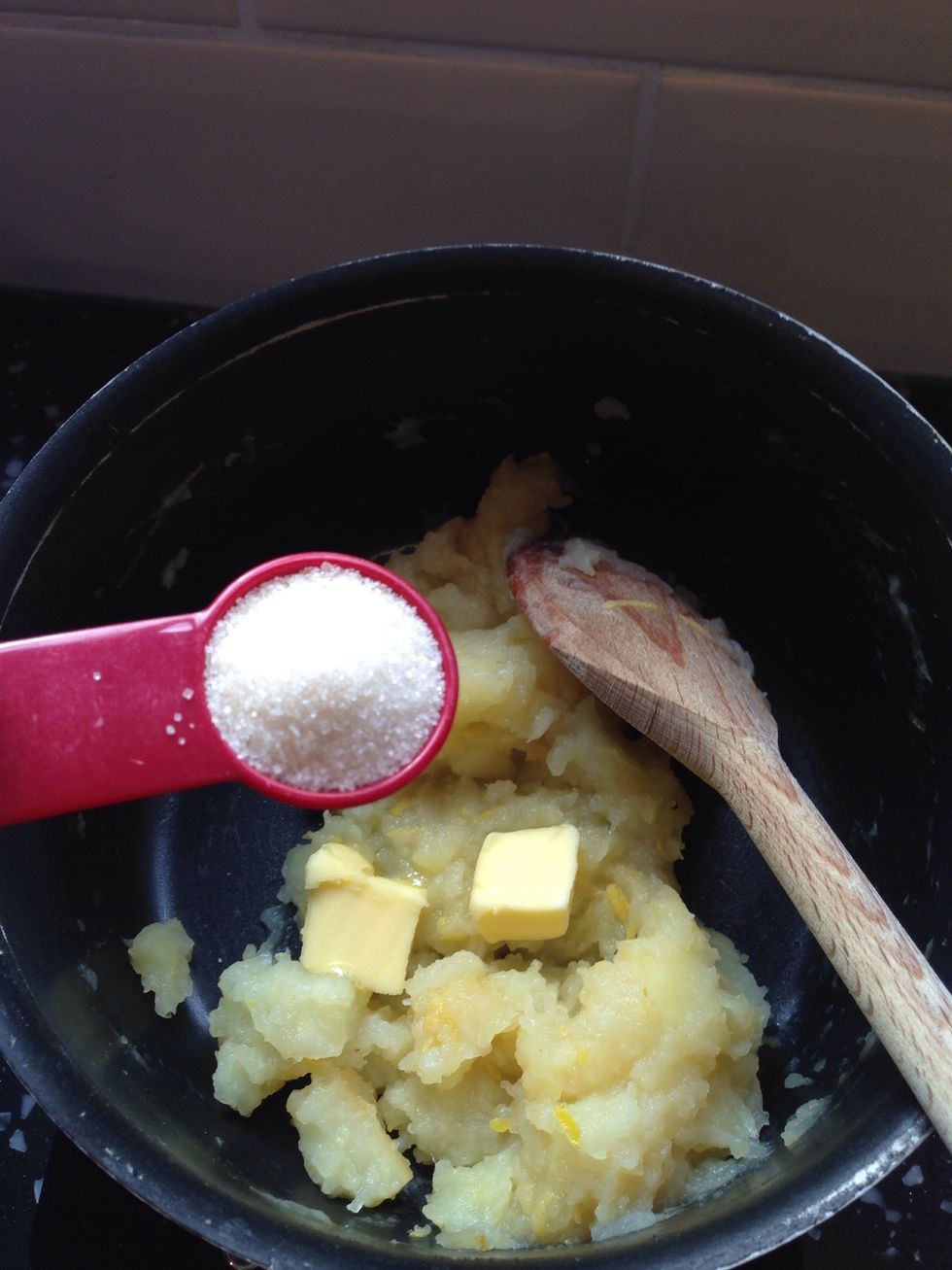 Add the sugar and butter to the slightly cooled mixture and beat until incorporated.