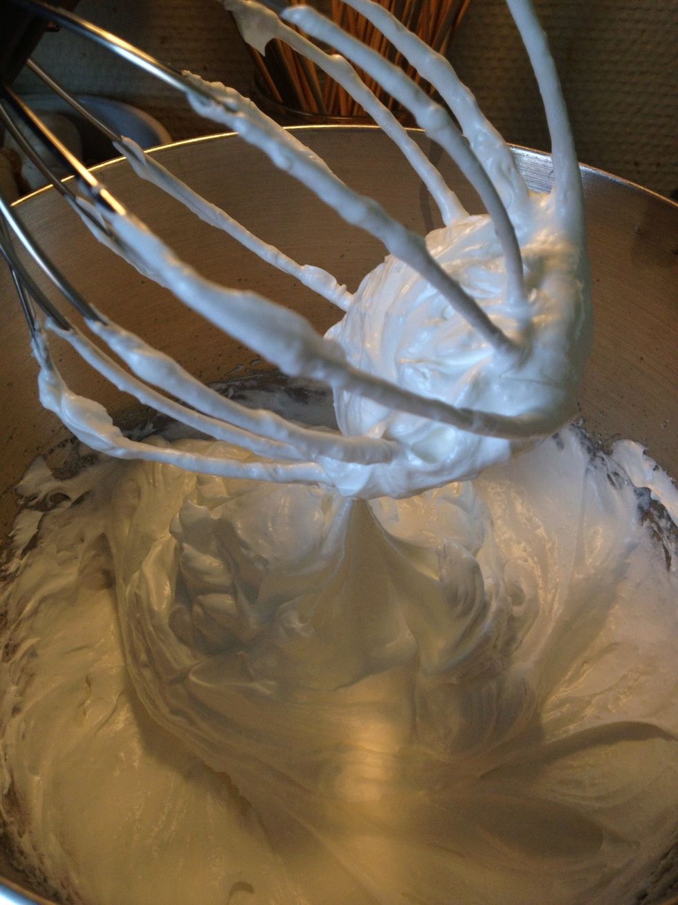 Add the sugar gradually while whisking. Whisk until the merengue is shiny and with solid peaks.