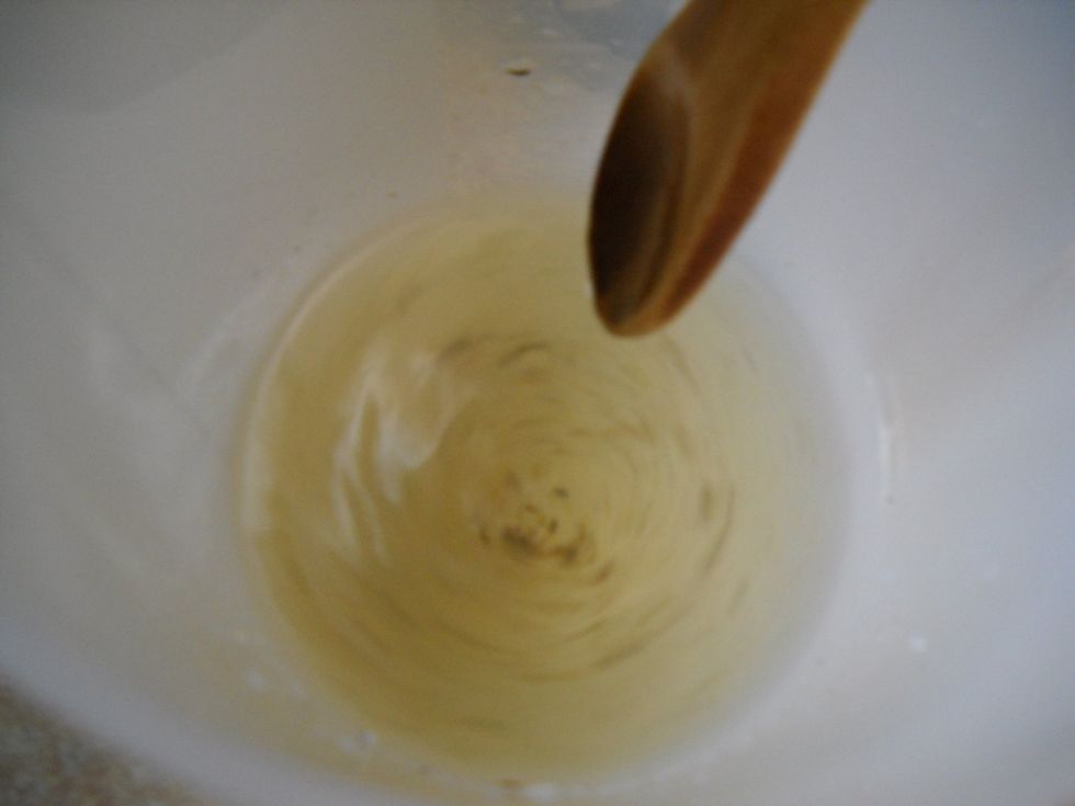 Add the sugar to the cold water in my pitcher and stir vigorously to dissolve. (You can see bits of lavender in the water. I actually strained those out after I mixed this up.)
