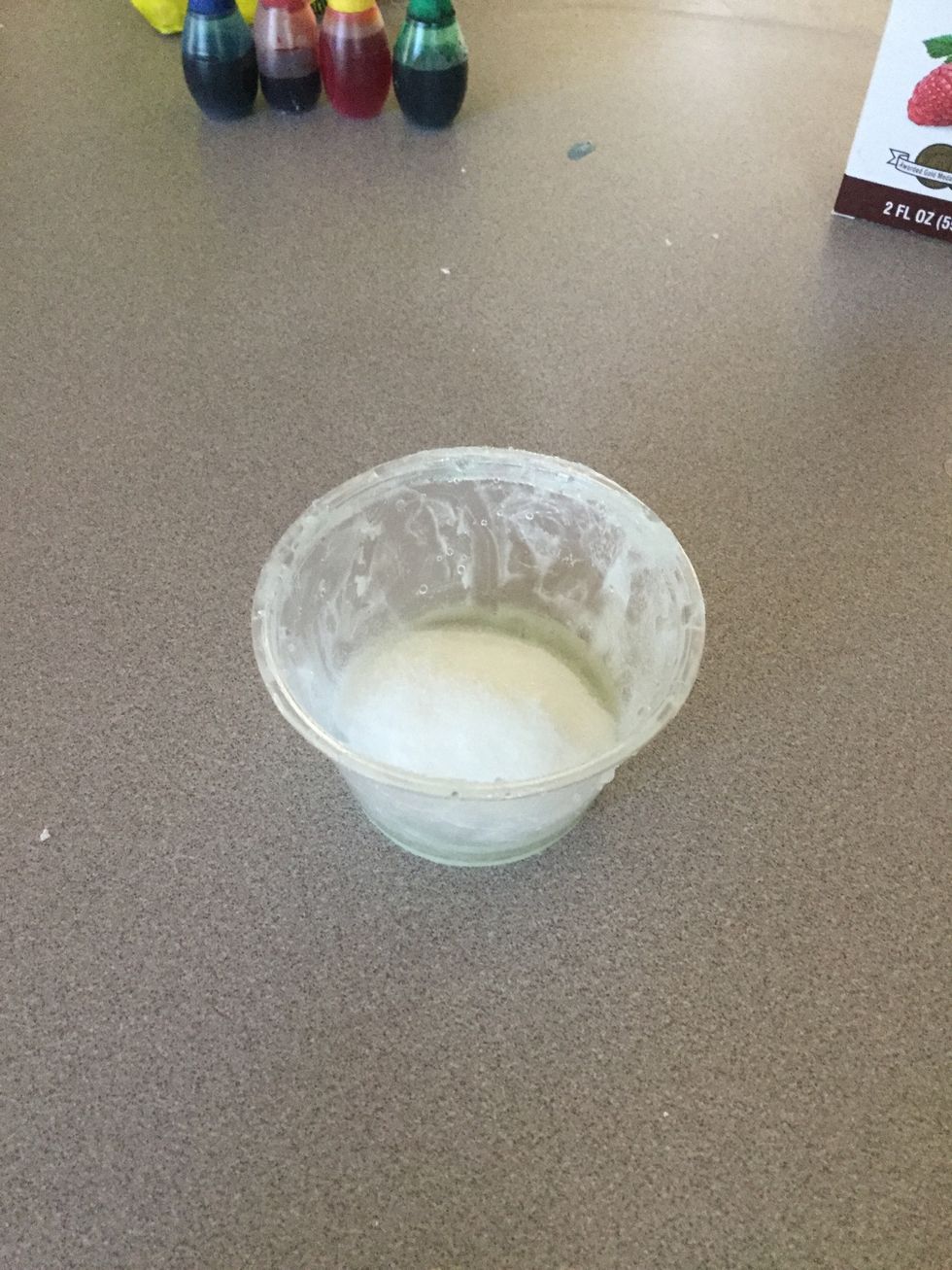 Add the sugar to the Vaseline