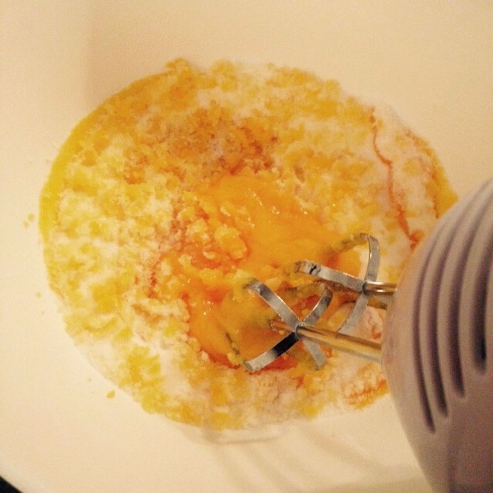 Add the sugar to the yolks and whisk together