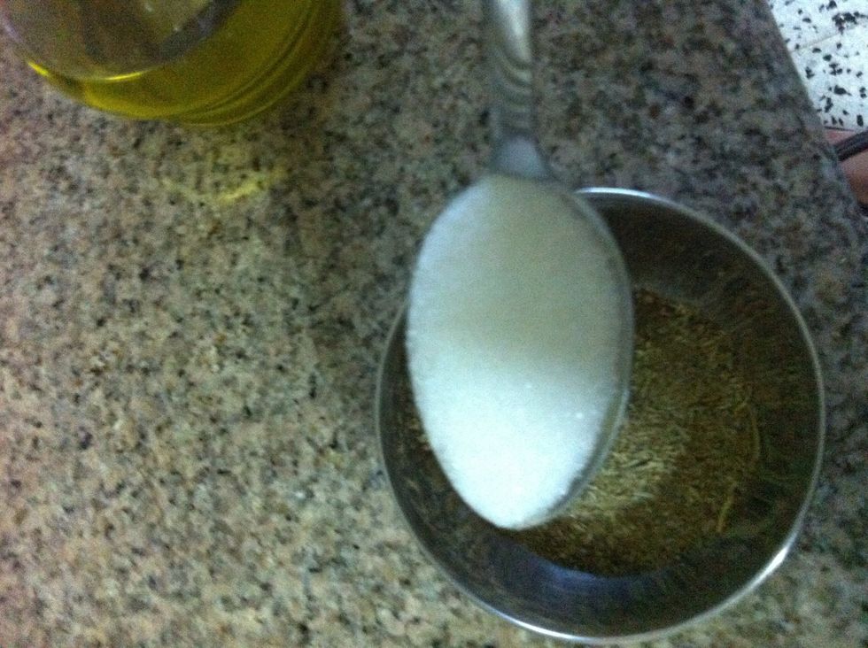 Add the sugar. We add sugar to balance the acidity in the lemons but to also carmalize the chicken and give it a little color and flavor!