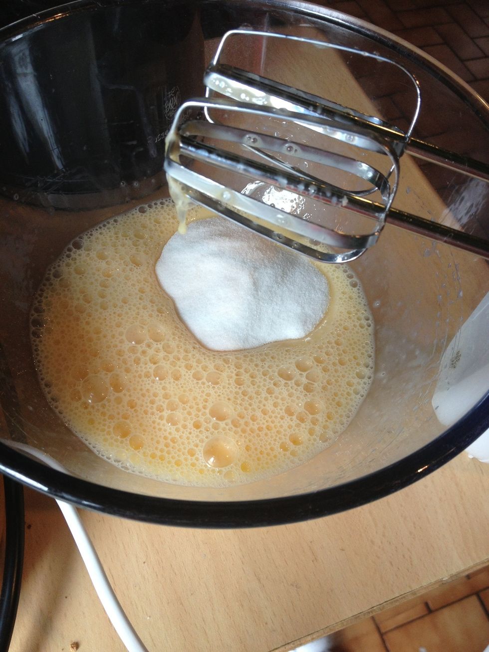 Add the sugar. You are going to beat the mixture on the highest setting for around 5 minutes. Don't stop unless you're sure it's done.