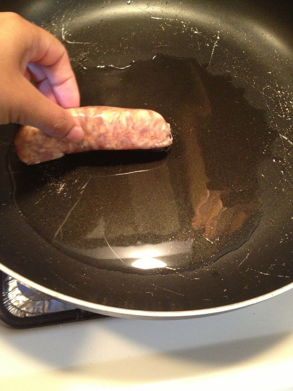 Add the sweet sausages and start browning them. While this is browning we will start slicing the vegetables.
