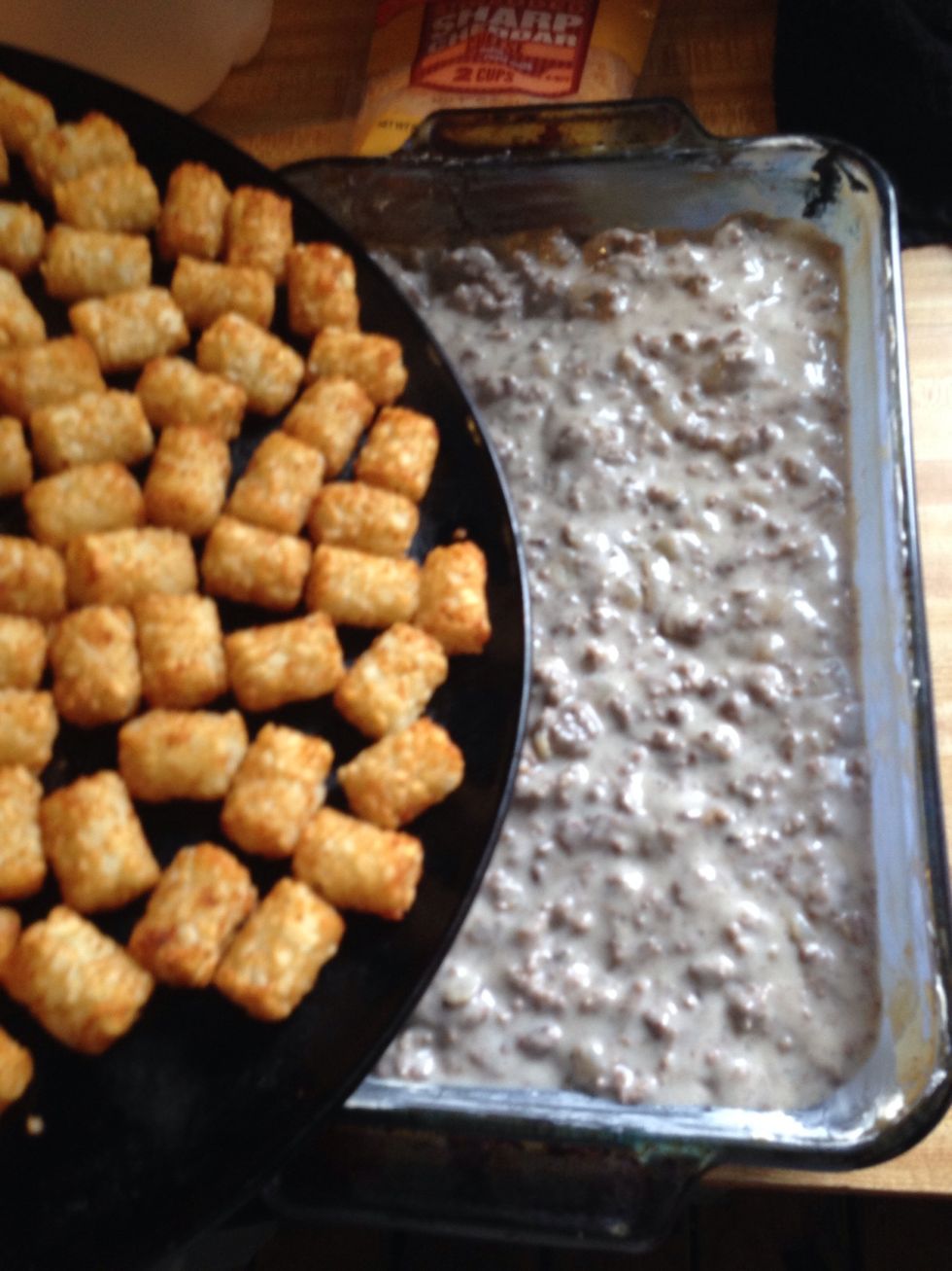 Add the tater tots to the top of the mixture...