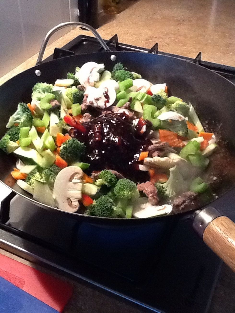 Add the teriyaki sauce to the meat and vegetables. Stir through until all the vegetables and meat are coated.