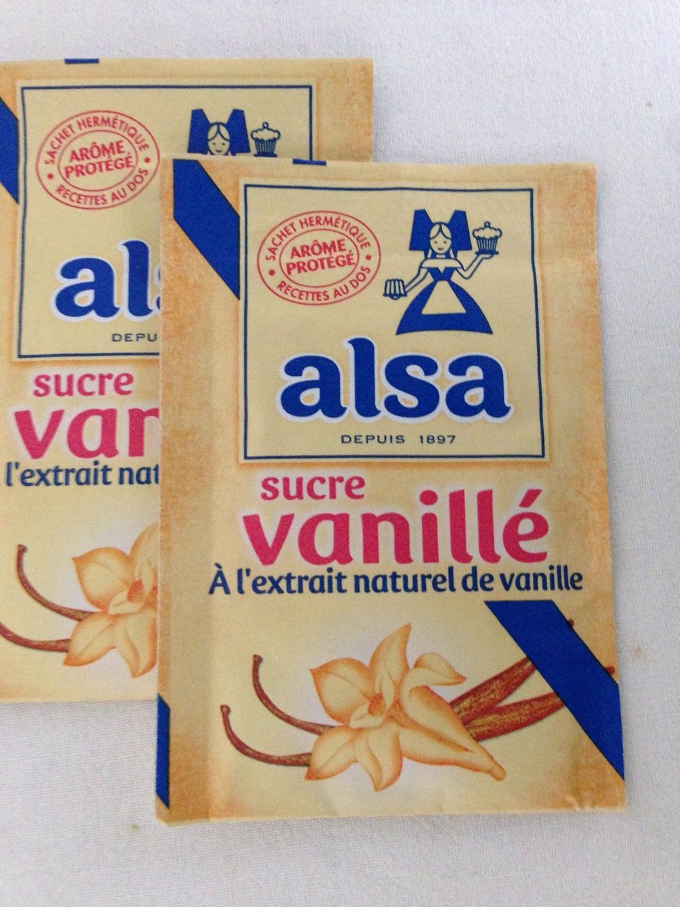 Add the the 2 envelopes; they make 20 grms of sugar with vanilla extract...exceptional shortcut. Otherwise use normal sugar and a tsp of vanilla extract