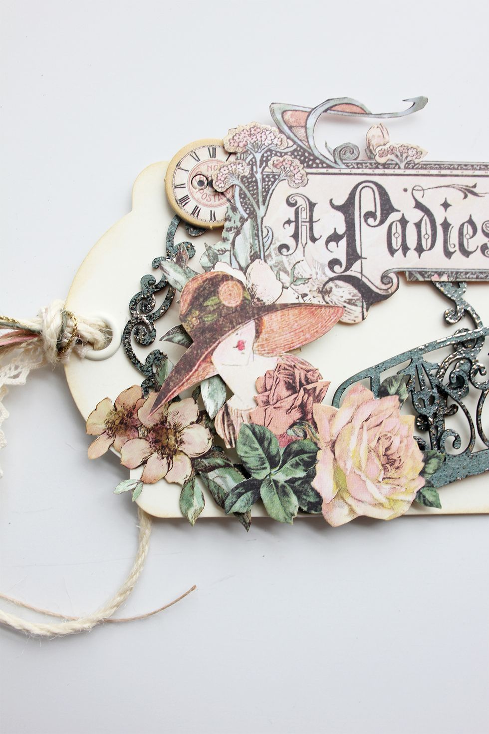 Add the third clock to the top, left side of the tag. Add the remainder of the cut images to the lower left side of the tag.