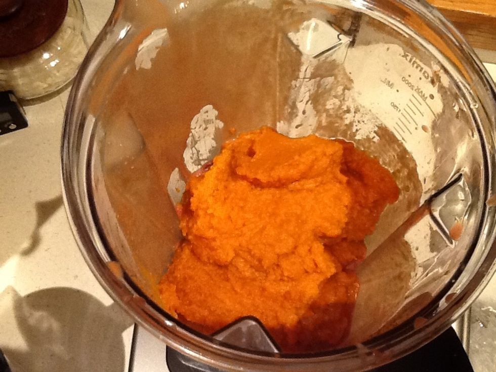 Add the third tub of liver and the small can of pumpkin. Mix until smooth and scrape into the bowl.