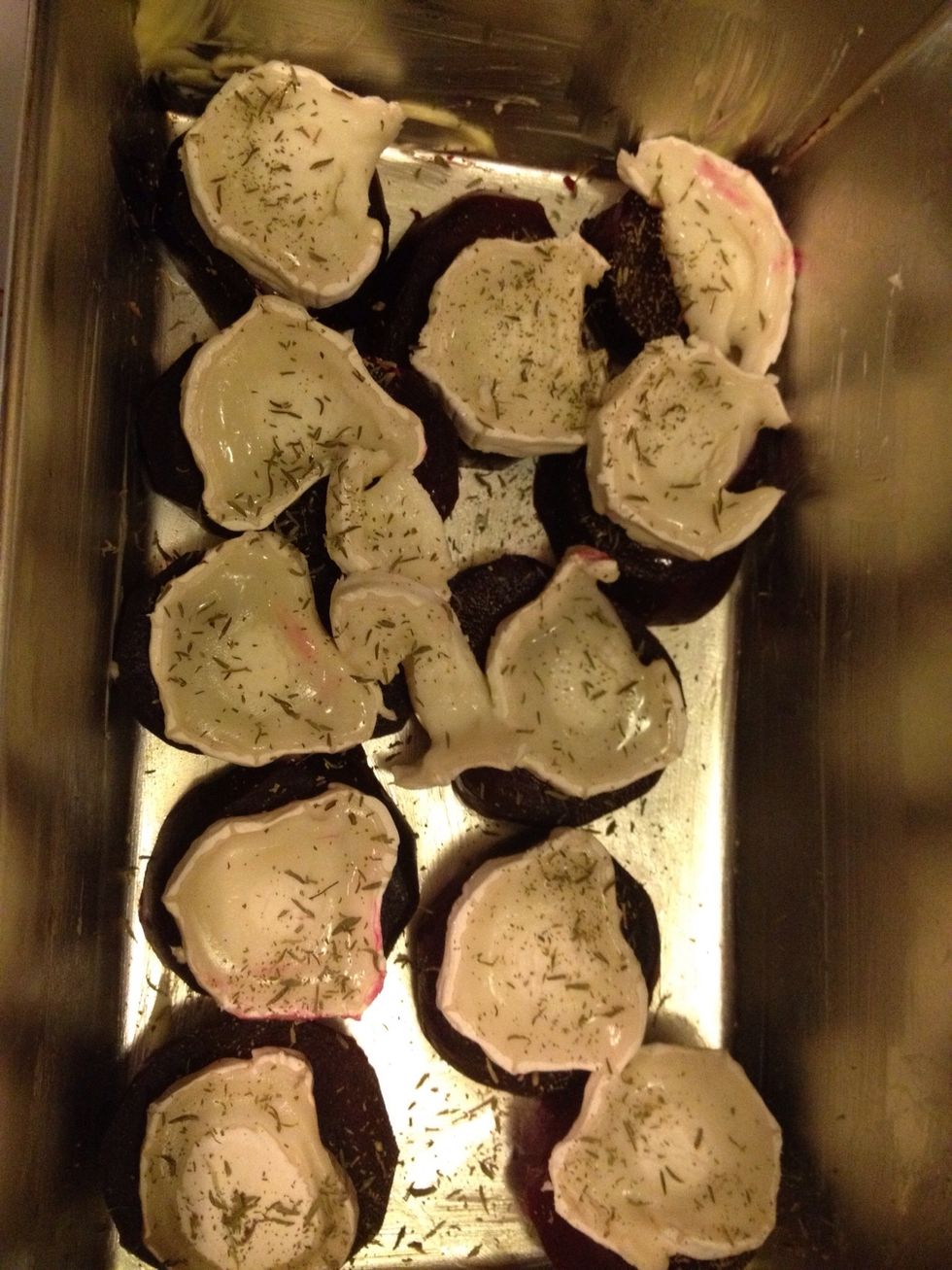 Add the thyme. Put the beetroots in the oven, 250 degrees Celsius for about 15 minutes, or long enough to brown the cheese.