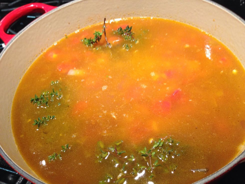 Add the thyme sprigs and cheese rind. Bring to a boil, lower heat and cover. Simmer for 30 minutes.