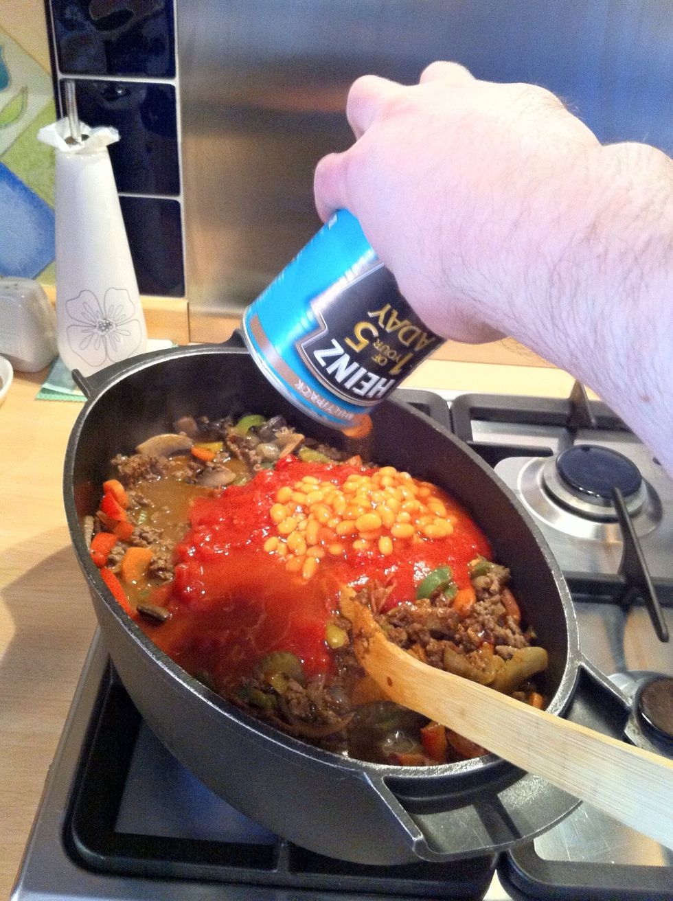 Add the tinned baked beans.