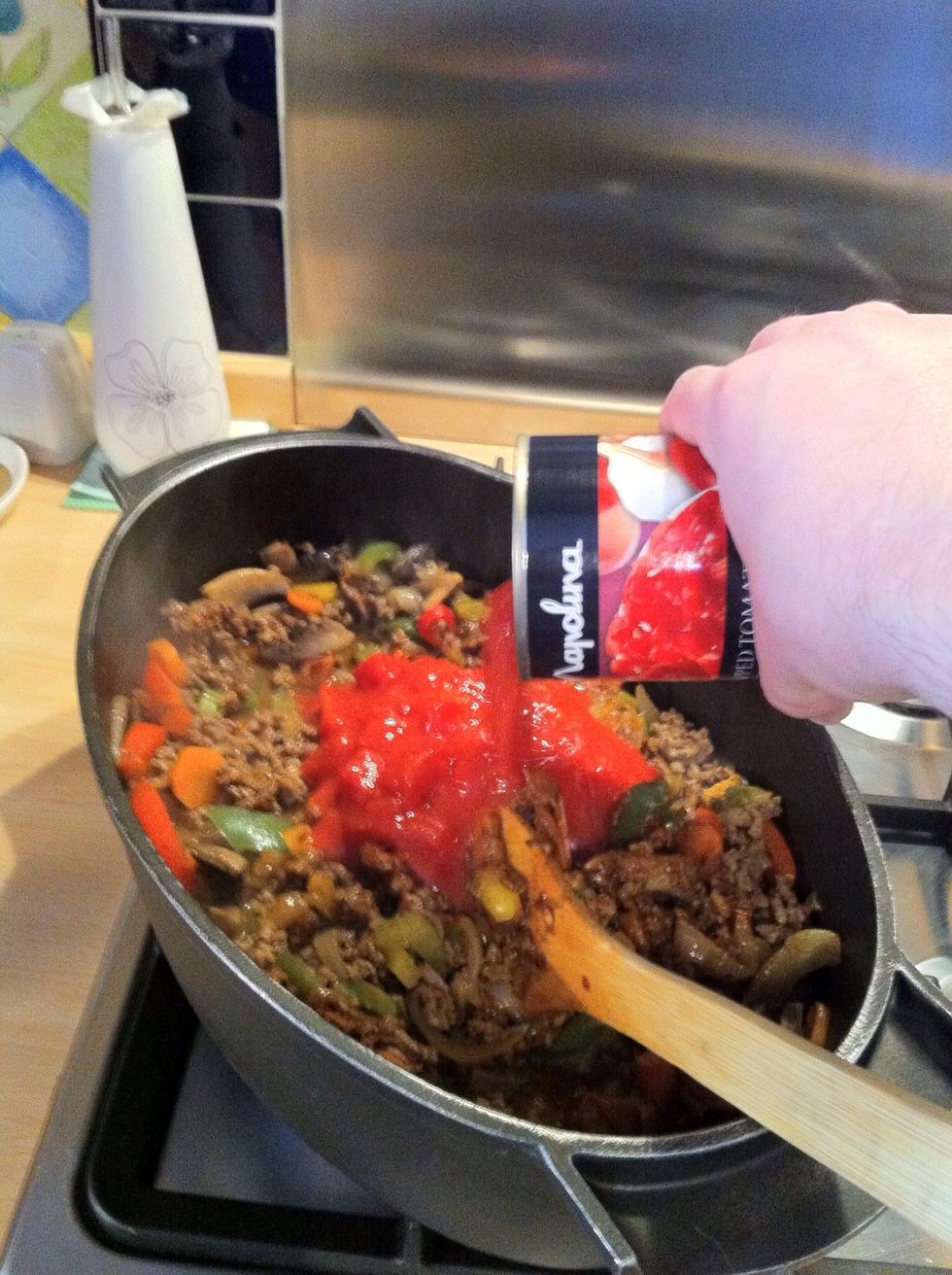 Add the tinned chopped tomatoes.