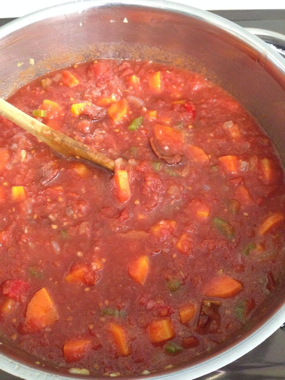 Add the tinned tomatoes, thyme, and pepper. Simmer for 30 minutes