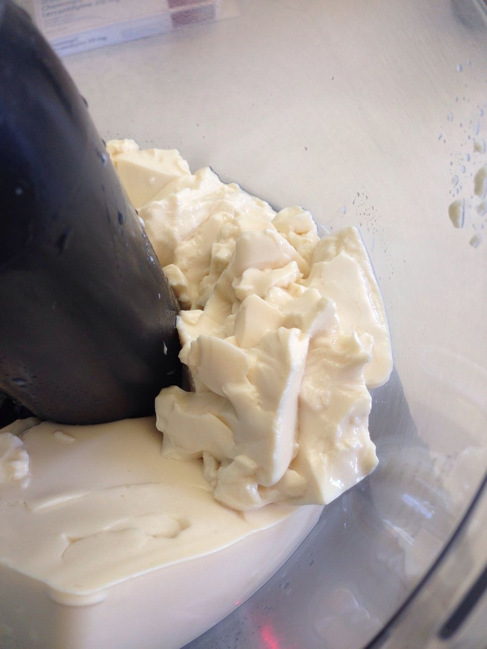 Add the tofu to the bowl of a food processor using the mixing blade not the chopping blade. This can be done in a blender instead if you wanted to.