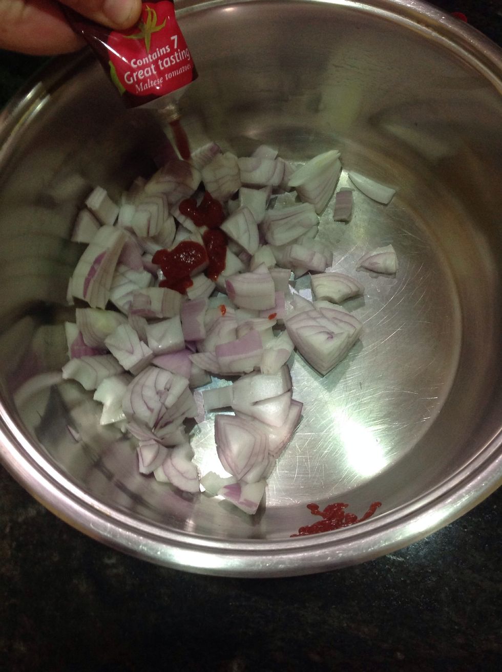 Add the tomato paste and cook for one minute while stirring constantly.