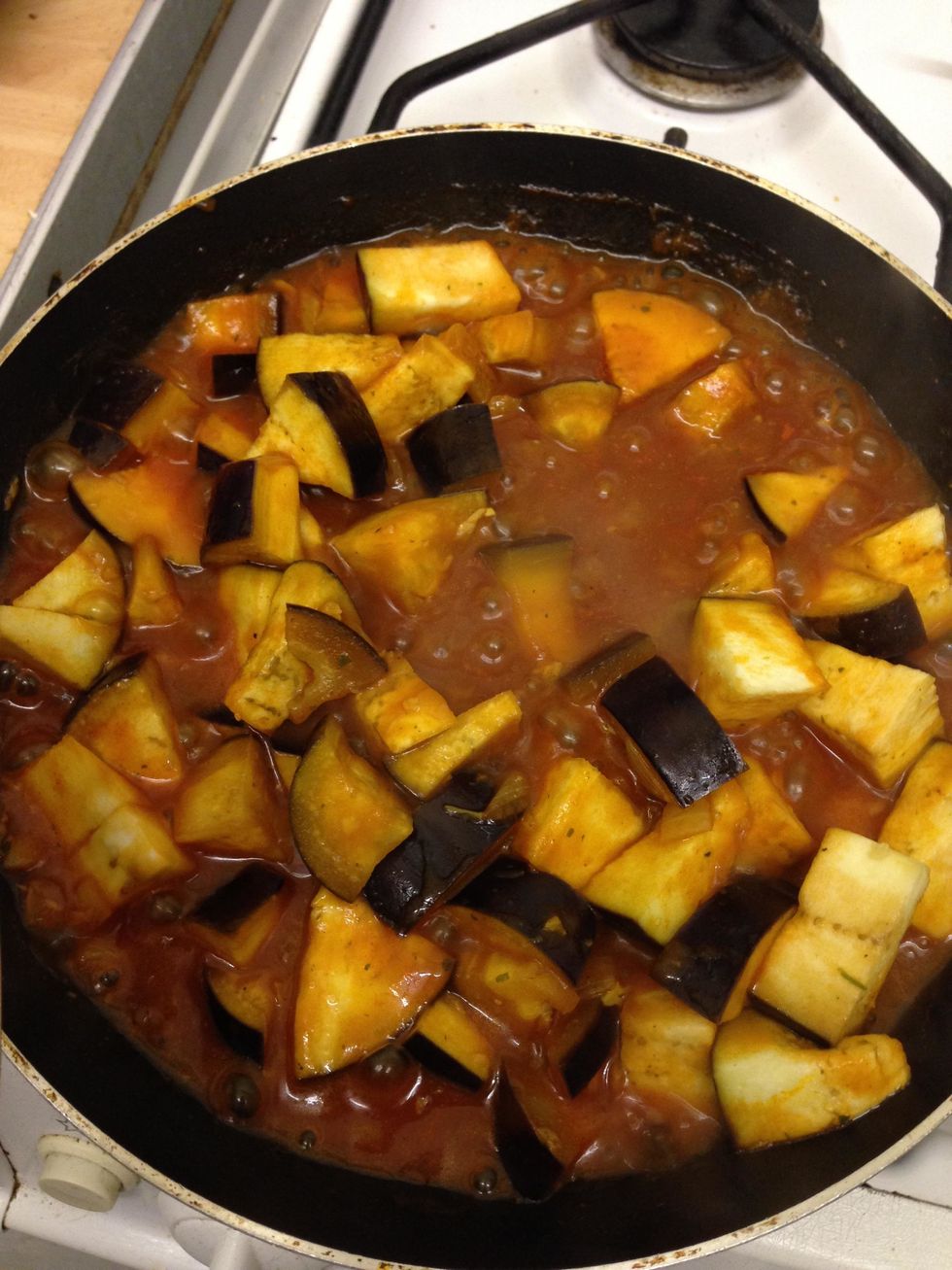 Add the tomato sauce to the aubergine and let it cook for about 8 minutes until the sauce is thickened and absorbed