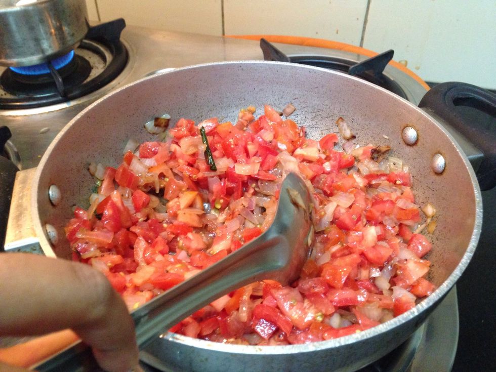 Add the tomatoes and keep stirring till it all mixes up.