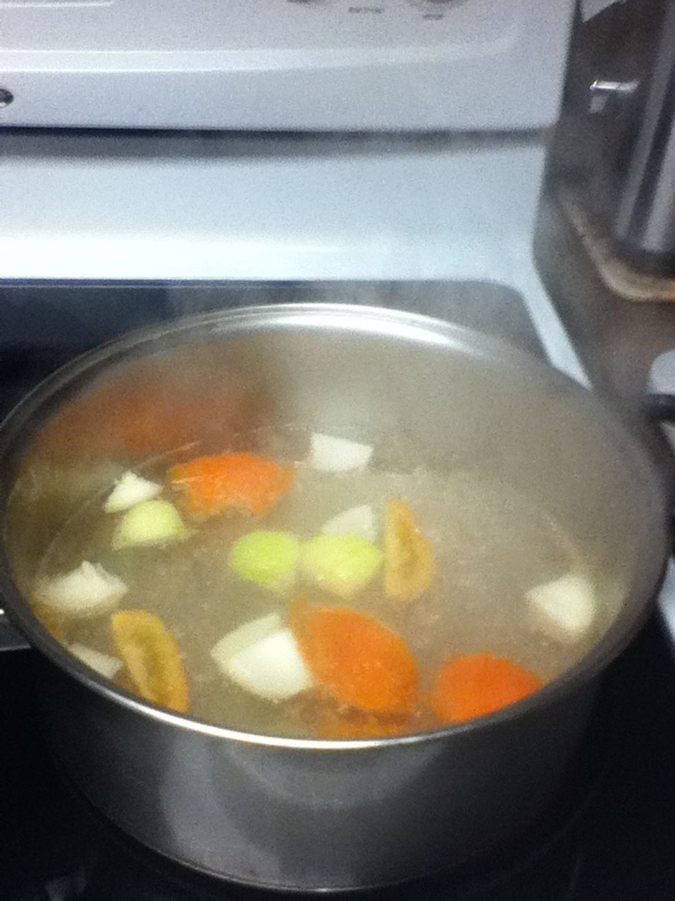 Add the tomatoes and onion and let it cook until its sort of soft