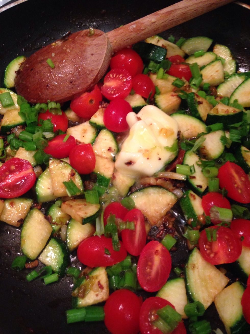 Add the tomatoes remaining butter the juice of all for lemon wedges and all but a small section of scallions