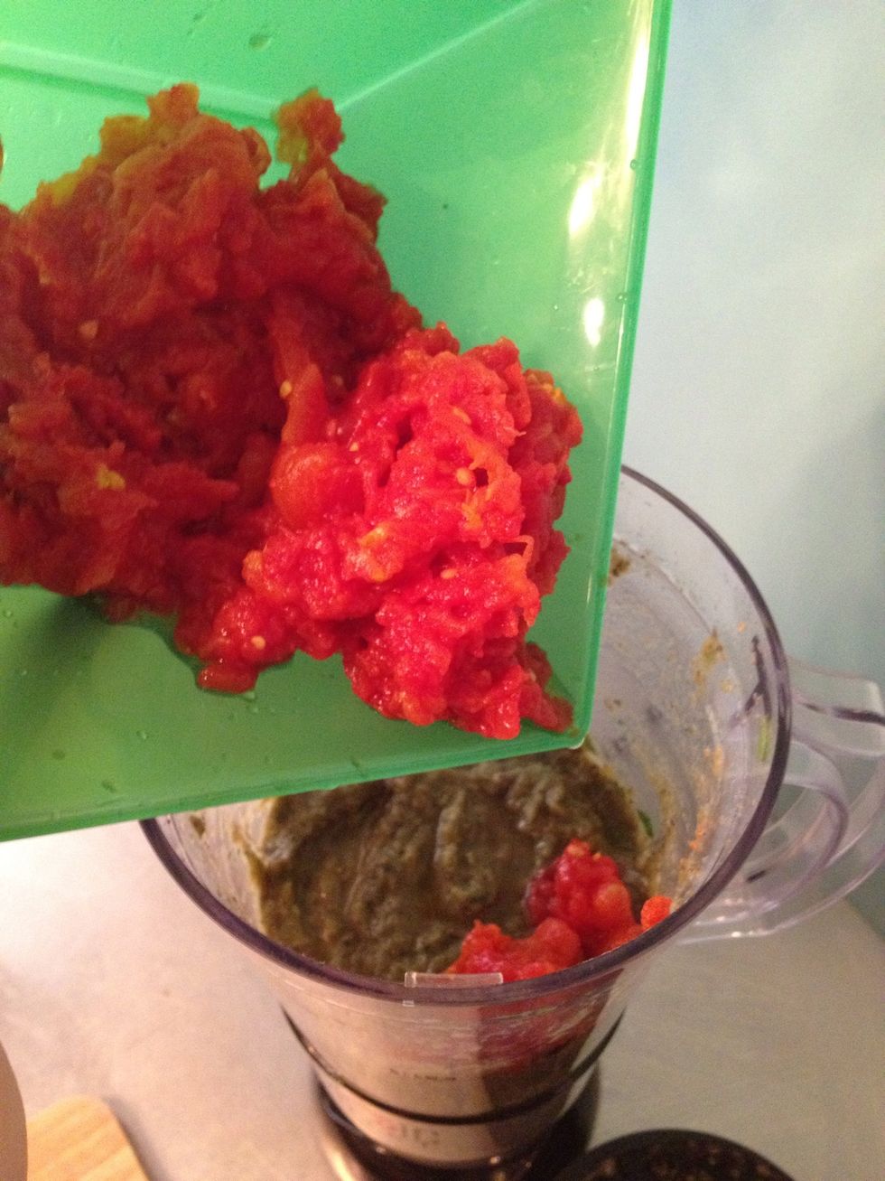 add the tomatoes to the food processor, don't pulse yet.